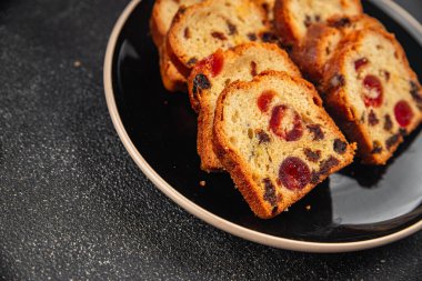 Fruit cake dessert sweet dried fruit traditional pastry, nuts meal food snack on the table copy space food background rustic top view clipart