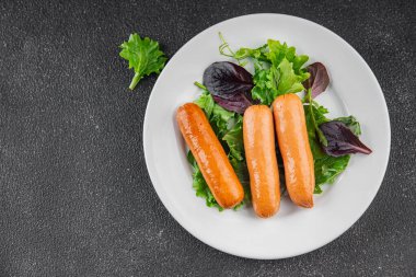 Sosisler et lezzetli lezzetli gurme yemek arka plan masa sade yemek üst manzara fotokopi alanı