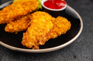 Tavuklu nuggetlar, kızarmış taze, lezzetli yemekler lezzetli gurme yemek arka planı, masa kırsal yiyeceklerin üst görüntüsü, fotokopi alanı.