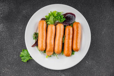 Sosisler et lezzetli lezzetli gurme yemek arka plan masa sade yemek üst manzara fotokopi alanı