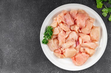 Tavuk, çiğ et, kümes hayvanları lezzetli lezzetli lezzetli gurme yemek arkaplanı, masa rustik gıdalar, fotokopi alanı ve paleo diyeti.