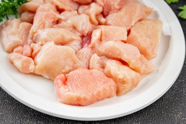 Tavuk, çiğ et, kümes hayvanları lezzetli lezzetli lezzetli gurme yemek arkaplanı, masa rustik gıdalar, fotokopi alanı ve paleo diyeti.