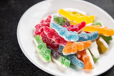 Jöleli şeker, tatlı, lezzetli gurme yemek arka planı, masa rustik yemekler, fotokopi alanı vejetaryen ve vejetaryen yemekleri.