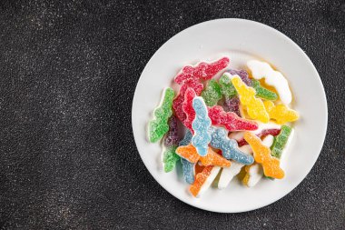 Jöleli şeker, tatlı, lezzetli gurme yemek arka planı, masa rustik yemekler, fotokopi alanı vejetaryen ve vejetaryen yemekleri.