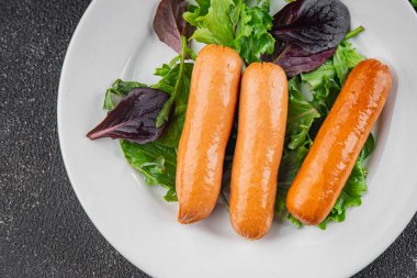 Sosisler et lezzetli lezzetli gurme yemek arka plan masa sade yemek üst manzara fotokopi alanı