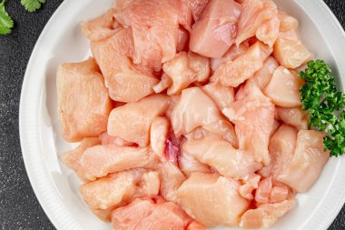 Tavuk, çiğ et, kümes hayvanları lezzetli lezzetli lezzetli gurme yemek arkaplanı, masa rustik gıdalar, fotokopi alanı ve paleo diyeti.