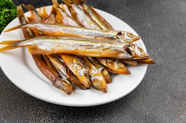 Tütsülenmiş balık capelin taze yemek gurme yemek arka planda masa rustik gıda üst görünüm kopyalama alanı  