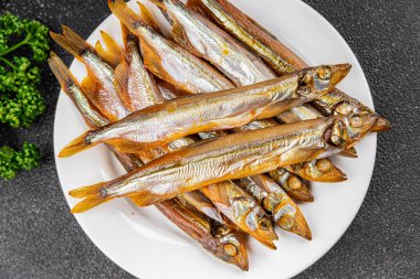 Tütsülenmiş balık capelin taze yemek gurme yemek arka planda masa rustik gıda üst görünüm kopyalama alanı  