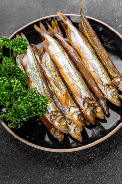 Tütsülenmiş balık capelin taze yemek gurme yemek arka planda masa rustik gıda üst görünüm kopyalama alanı  
