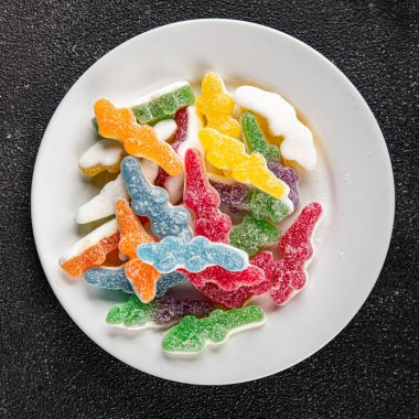 Jöleli şeker, tatlı, lezzetli gurme yemek arka planı, masa rustik yemekler, fotokopi alanı vejetaryen ve vejetaryen yemekleri.