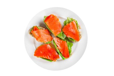 Somon sandviçi kırmızı balık deniz ürünleri aperatif taze gurme yemek arka planı masa rustik gıda üst görünüm fotokopi alanı pesseeter diyet