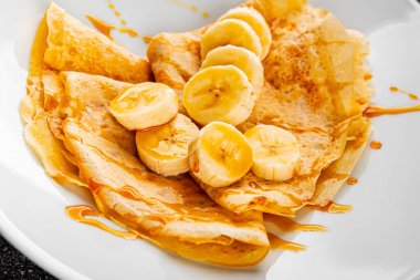 Krep, muz şurubu, krep kahvaltı, tatlı tatlı, organik ürün, lezzetli gurme yemek arkaplan, masa kırsal yiyeceklerin üst görünümü, fotokopi alanı.