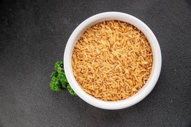 Kahverengi pirinç, tahıl, tahıl, sağlıklı yiyecek, süper yemek, lezzetli gurme, yemek, masa üstü yemek, fotokopi, uzay keto, paleo diyet vejetaryen ve vejetaryen yemekleri.