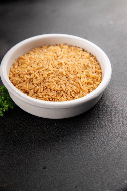 Kahverengi pirinç, tahıl, tahıl, sağlıklı yiyecek, süper yemek, lezzetli gurme, yemek, masa üstü yemek, fotokopi, uzay keto, paleo diyet vejetaryen ve vejetaryen yemekleri.