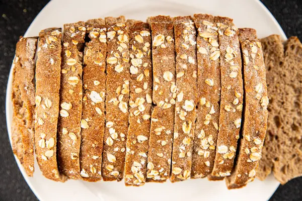 Yulaf ekmeği kepekli, kepekli, kepekli, kepekli, doğal, lezzetli, lezzetli gurme yemek arkaplanı masa kırsal gıdanın üstünde fotokopi alanı.