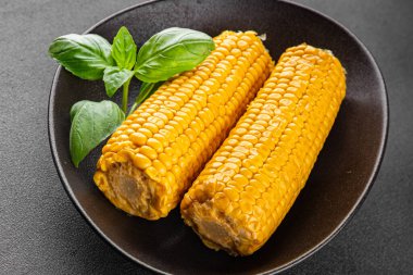 Mısır koçanı yiyeceği, abur cubur, sebze, lezzetli gurme yemek arkaplanı, kırsal yiyecekler, fotokopi alanı.