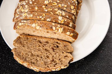 Yulaf ekmeği, kepekli çörek, yulaf ezmesi, hamur işi, doğal yemek, gurme yemek arka planı, kırsal yiyecekler, fotokopi alanı.