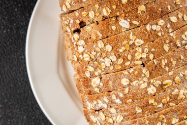 Yulaf ekmeği, kepekli çörek, yulaf ezmesi, hamur işi, doğal yemek, gurme yemek arka planı, kırsal yiyecekler, fotokopi alanı.