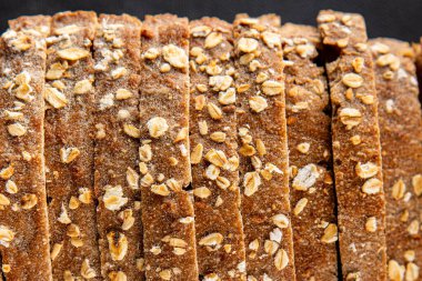 Yulaf ekmeği, kepekli çörek, yulaf ezmesi, hamur işi, doğal yemek, gurme yemek arka planı, kırsal yiyecekler, fotokopi alanı.