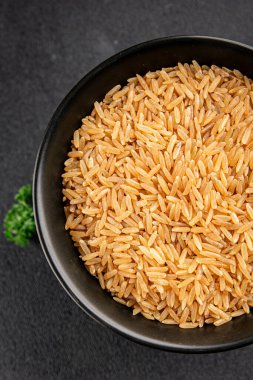 Kahverengi pirinç, tahıl, tahıl, sağlıklı yiyecek, süper yemek, lezzetli gurme, yemek, masa üstü yemek, fotokopi, uzay keto, paleo diyet vejetaryen ve vejetaryen yemekleri.