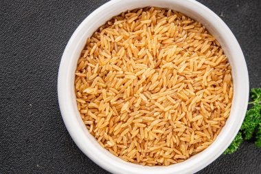 Kahverengi pirinç, tahıl, tahıl, sağlıklı yiyecek, süper yemek, lezzetli gurme, yemek, masa üstü yemek, fotokopi, uzay keto, paleo diyet vejetaryen ve vejetaryen yemekleri.