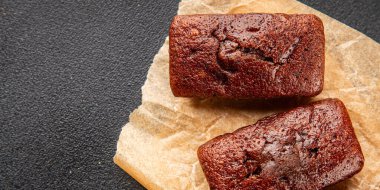 Biscuit Financier çikolatalı kurabiye tatlı tatlı lezzetli gurme yemek arkaplanı masa rustik gıda üst görünüm fotokopi alanı