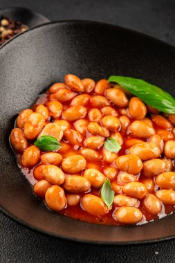 Fasulye güveci domates sosu yaban mersini fasulyesi fasulye fasulyesi Borlotti taze lezzetli gurme yemek arkaplanı masaya rustik gıda üst görünüm fotokopi alanı keto ve paleo diyet vegan ve vegan gıda