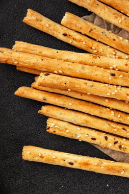 Grissotti ekmek çubuğu Grissini tahıl gevreği tahıl gevreği taze lezzetli gurme yemek arkaplanı masa rustik gıda üst görünümü fotokopi alanı