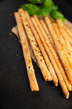 Grissotti ekmek çubuğu Grissini tahıl gevreği tahıl gevreği taze lezzetli gurme yemek arkaplanı masa rustik gıda üst görünümü fotokopi alanı
