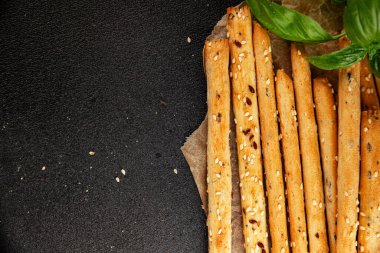 Grissotti ekmek çubuğu Grissini tahıl gevreği tahıl gevreği taze lezzetli gurme yemek arkaplanı masa rustik gıda üst görünümü fotokopi alanı