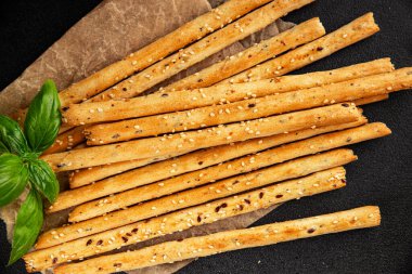 Grissotti ekmek çubuğu Grissini tahıl gevreği tahıl gevreği taze lezzetli gurme yemek arkaplanı masa rustik gıda üst görünümü fotokopi alanı