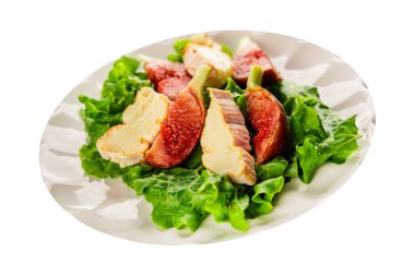 Salata inciri, yumuşak peynir, yeşil yaprak marul lezzetli aperatif lezzetli lezzetli gurme yemek arkaplan masa üzerinde rustik gıda üst görünüm fotokopi alanı keto ve paleo diyet vejetaryen gıda