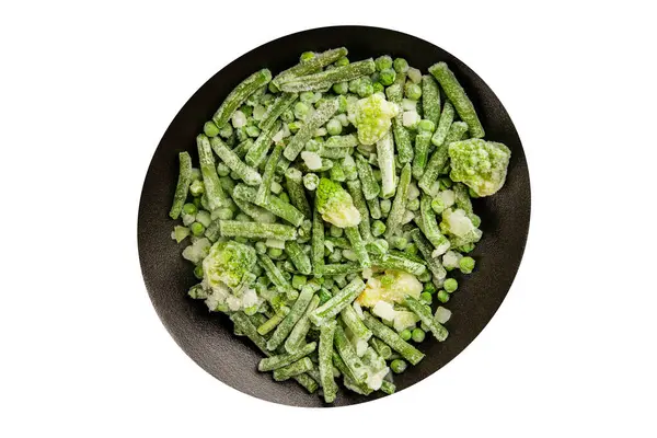 Donmuş yeşil sebzeler bezelye, brokoli, çalı fasulyesi, kohlrabi lahanası lezzetli çerez masadaki lezzetli gurme yemek arka planı rustik yemekler fotokopi alanı keto ve paleo diyeti vejetaryen ve vejetaryen yemekleri.