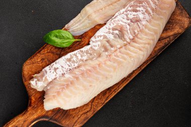 Fileto morina balığı deniz mahsulleri yaygın ling doğal ürün lezzetli aperatif lezzetli lezzetli gurme yemek arkaplan masa üzerinde rustik üst görünüm fotokopi alanı pesseeter diyet