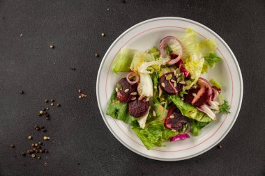 Beet salad green leaf lettuce vegetables natural product tasty snack fresh delicious gourmet food background on the table rustic top view copy space keto and paleo diet vegan and vegan food