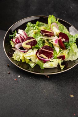 Beet salad green leaf lettuce vegetables natural product tasty snack fresh delicious gourmet food background on the table rustic top view copy space keto and paleo diet vegan and vegan food