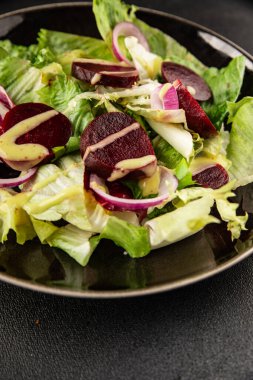 Beet salad green leaf lettuce vegetables natural product tasty snack fresh delicious gourmet food background on the table rustic top view copy space keto and paleo diet vegan and vegan food