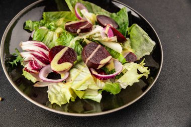 Beet salad green leaf lettuce vegetables natural product tasty snack fresh delicious gourmet food background on the table rustic top view copy space keto and paleo diet vegan and vegan food