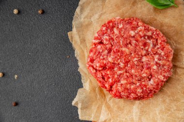 Raw cutlet meat burger ground meat beef, pork fresh natural product tasty snack delicious gourmet food background on the table rustic top view copy space