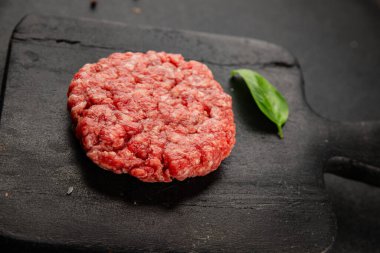 Raw cutlet meat burger ground meat beef, pork fresh natural product tasty snack delicious gourmet food background on the table rustic top view copy space