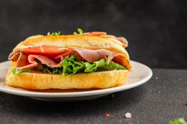 Ham sandwich green leaf salad, spam, meat snack vegetables natural product tasty tasty snack fresh delicious gourmet food background on the table rustic top view copy space