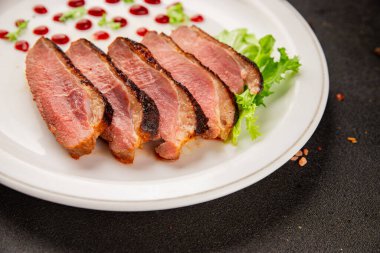 Duck breast roast poultry fresh natural product tasty snack delicious gourmet food background on the table rustic top view copy space