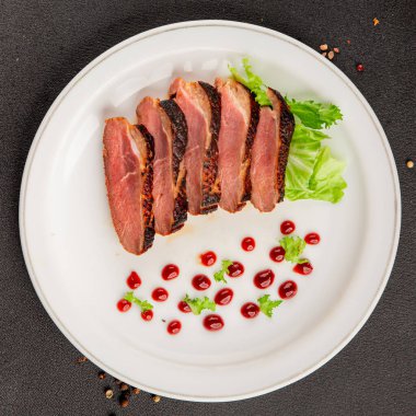 Duck breast roast poultry fresh natural product tasty snack delicious gourmet food background on the table rustic top view copy space