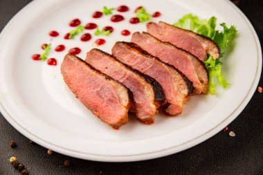 Duck breast roast poultry fresh natural product tasty snack delicious gourmet food background on the table rustic top view copy space