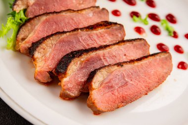 Duck breast roast poultry fresh natural product tasty snack delicious gourmet food background on the table rustic top view copy space