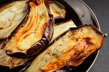 Baked eggplant grilled vegetables fresh natural product tasty snack delicious gourmet food background on the table rustic top view copy space keto and paleo diet vegan and vegan food