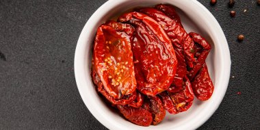 Sun-dried tomatoes snack vegetables natural product tasty snack fresh delicious gourmet food background on the table rustic top view copy space keto and paleo diet vegan and vegan food