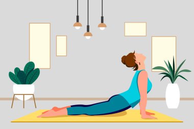 Evde yoga stüdyosu var. Evde yoga dersleri. Modern bir apartmanın içinde. Yoga konsepti.