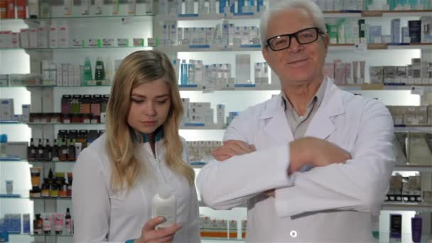 Two Pharmacists Posing Drugstore Senior Male Druggist Medical Uniform Crossing — Stock Video
