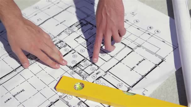 Close Male Fingers Pointing Plan Building Construction Two Men Dragging — Stock Video